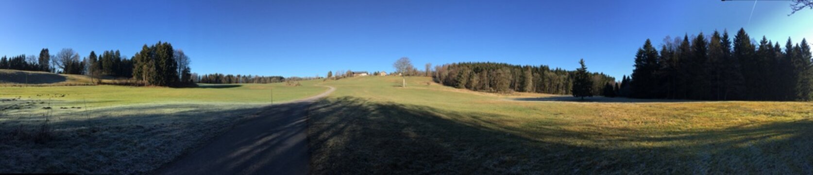 Beautiful farm panorama with, meadows and blue sky near Uffing, Murnau and Kochel in Germany