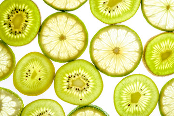 Bright citrus lime and kiwi slices on white