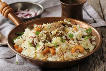 Kerala Malabar Mutton Biryani served with yogurt dip, selective focus