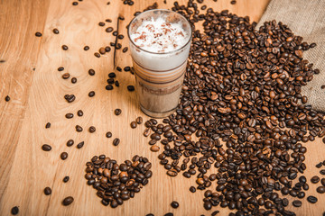 caf&eacute; latte macchiato with coffee beans