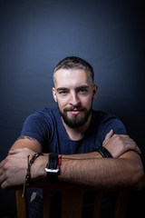 Portrait of a young man with a beard. Toned