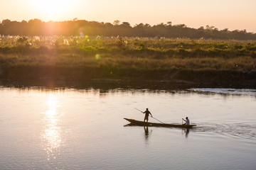 November 17, 2013 - men are fishing on Rapti river at the border of Chitwan national park, Nepal