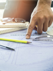 architect point at blueprint, architectural concept
