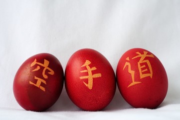 Painted Easter eggs with karate hieroglyphs.