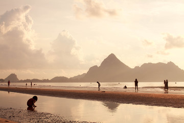 Alone Child girl playing at beach.