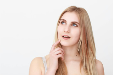 Naklejka premium Closeup portrait of a beautiful young blond woman with clean face