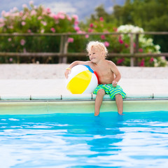 Child in swimming pool on summer vacation