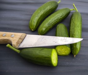 Cucumber, organic natural sailor cucumber pictures, cutting a cucumber with a knife, cucumber pictures on different topics
