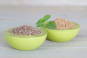 Healthy Chia seeds in green bowls. Grained and grinded chia seed.