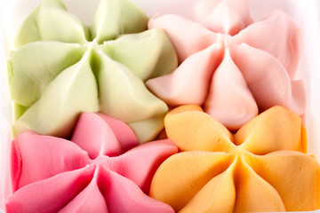 Colorful ice cream in the shape of a flower close-up top view