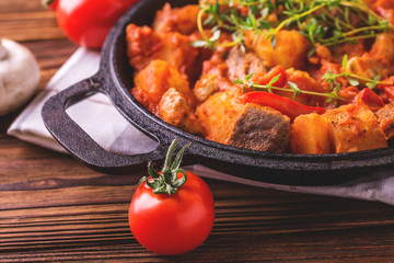 Traditional goulash soup close-up on  wooden table. Ingredients.