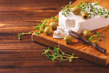 Greek cheese feta with thyme and green olives