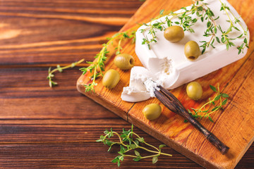 Greek cheese feta with thyme and green olives