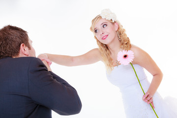 Happy groom and bride posing for marriage photo