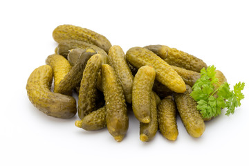 Marinated pickled cucumbers isolated on the white.