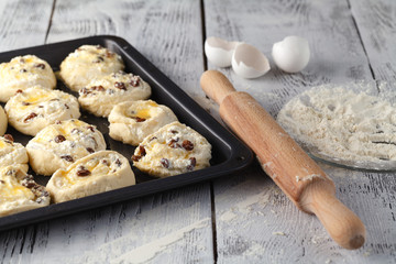 Making Sweet Raisin Dough, Hands Dusting Dough Ball with Flour