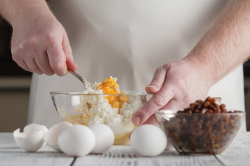 Ingredients for baking : cottage cheese, eggs and flour on the table