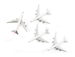 Fototapeta na wymiar Toy airplane / Plastic toy airplane on white background. Top view.