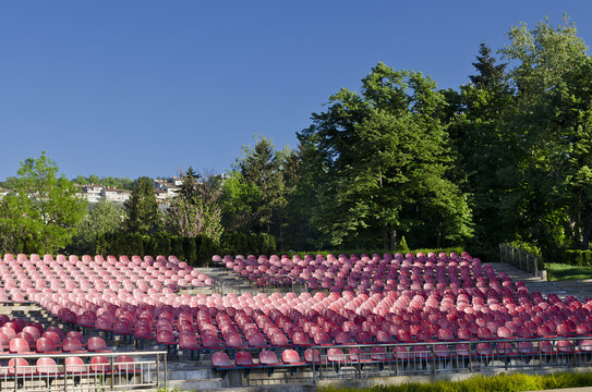 Empty red seats in an open space