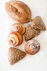 Bakery, bread and sweet buns on a white background with space for your text