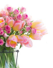 Bouquet of fresh pink and yellow tulips and roses flowers isolated on white background