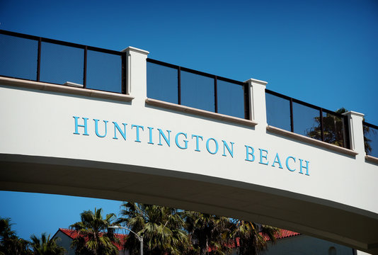 huntington beach sign on bridge over pacific coast highway