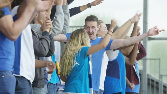  Crowd cheering at sports event, Italian fans wearing team colours