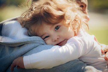 Child on father's shoulder