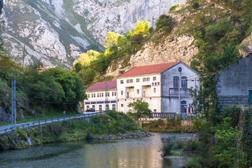 Fototapeta na wymiar The river Rio Cares in the National Park Los Picos de Europa. The mountain stream is known because of the narrow and spectacular canyon it forms when passing the Picos de Europa