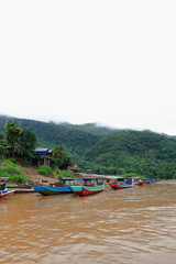 Slowboats moored-Nam Ou river pier. Muang Khua-Phongsali province-Laos. 3817