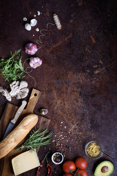 Sandwich Cooking Ingredients. French Baguette With Cheese And Vegetables Over Rustic Counter Top. View Above, Copy Space.