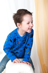 Handsome child on a light background