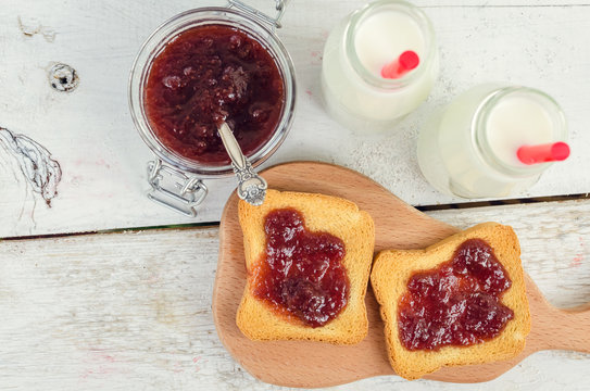 Toasts with strawberry jam and milk