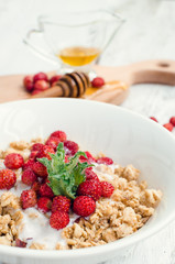 Granola with yoghurt and wild strawberries