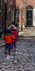 Children on Cobblestone Street