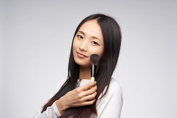 make-up brushes in woman's hand