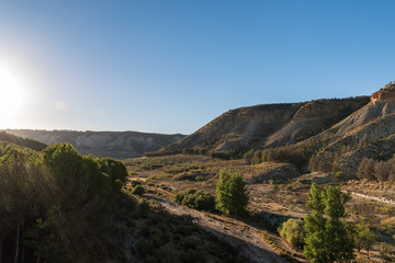 sunset over a canyon in the mountains