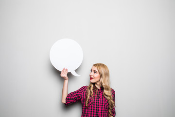 Young woman with speech bubble on grey background