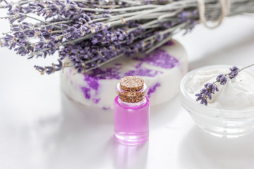 Obraz na płótnie Canvas body cream with lavender herbs cosmetic white background
