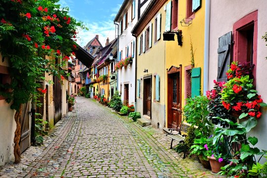 Picturesque street in the of the town of Eguisheim, Alsace, France