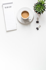 Obraz na płótnie Canvas business plan development with list and coffee desk background top view mock-up