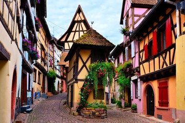 Fototapeta na wymiar Colorful timbered houses of the Alsatian town of Eguisheim, France