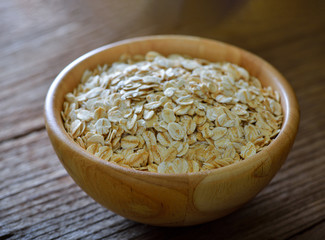 Rolled oats on a wooden table