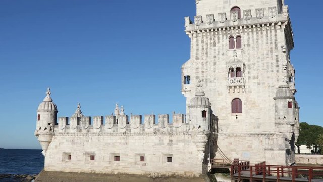 Tilt up video shot of Belem Tower at clear sunny day. Lisbon, Portugal
