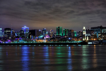 Beautiful view of downtown Montreal during evening in reflection in St Lawrence river in Montreal, Canada
