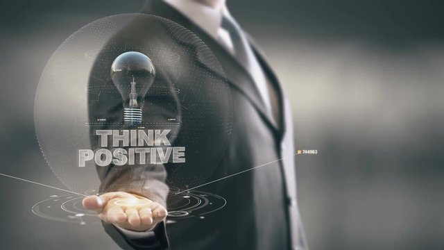 Think Positive with bulb hologram businessman concept