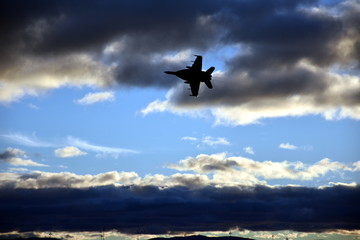 Fototapeta na wymiar Canberra, Australia - March 18, 2017. An adrenalin rushing RAAF F/A-18F Super Hornet jet handling display at Regatta Point in the Commonwealth Park.