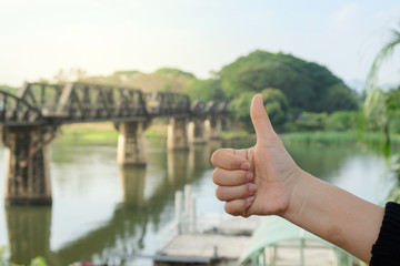 Closeup hand with tourists in a friendly woman with a background rail travel.