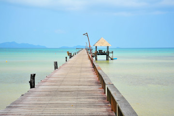 Fototapeta na wymiar Beach on Tropical Islands with Wooden Piers