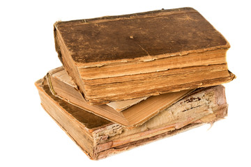Old books piled together over white background